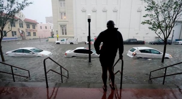 PHOTO Sad Picture Of Man Looking At Cars Flooded In Florida Over Hurricane Sally