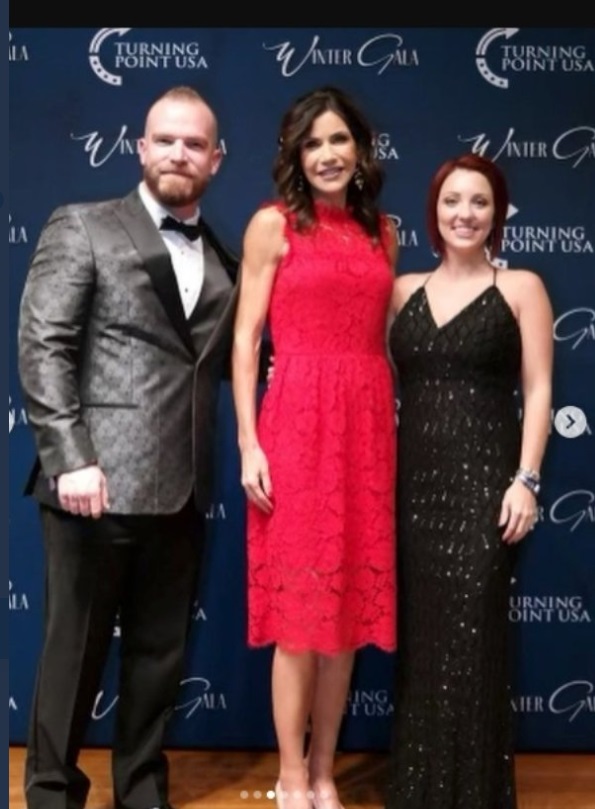 PHOTO Kristi Noem At Trump Mar-A-Lago Chrismtas Party In Bright Red Dress