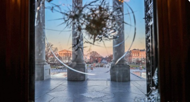 PHOTO Of Broken Glass Window At The Capitol Building In DC