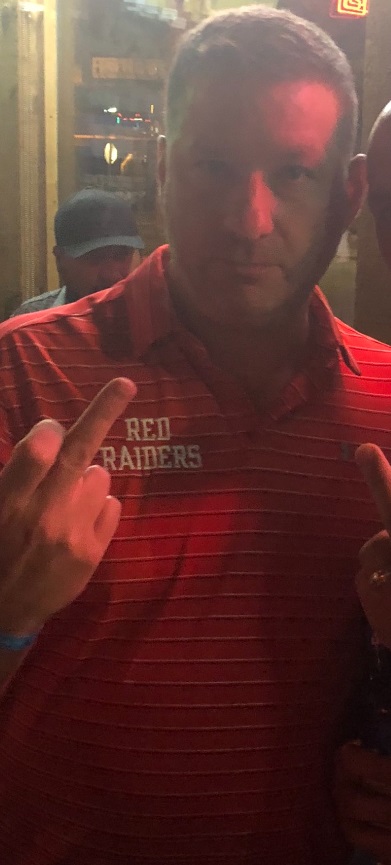 PHOTO Chris Beard Flipping People Off At Restaurant In Lubbock With Red Raiders Shirt On