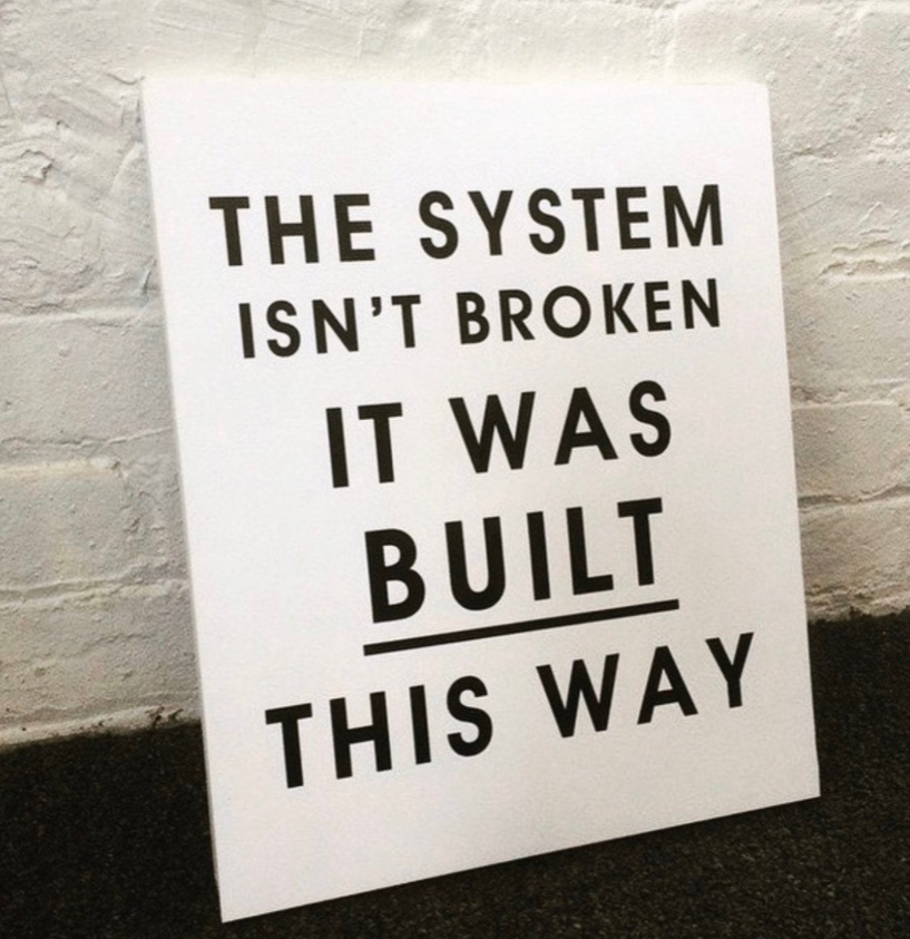 PHOTO Protester Leaves Sign Behind In Brooklyn Center Minnesota That Says The System Isn't Broken It Was Build This Way