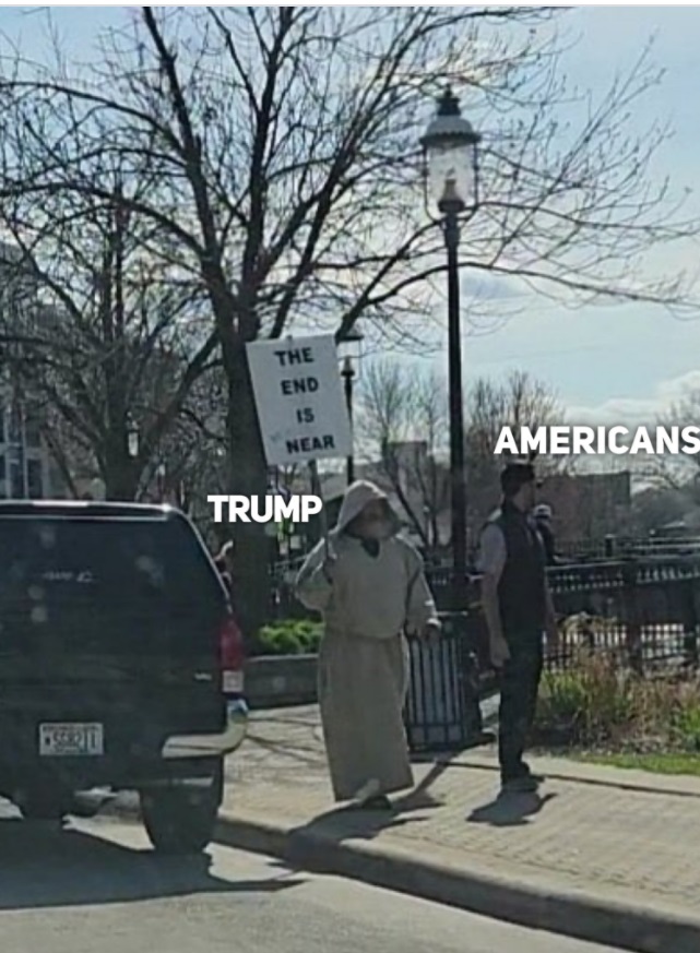 PHOTO Trump Supporter Holding A Sign That Says The End Is Near Americans Looking Away Meme