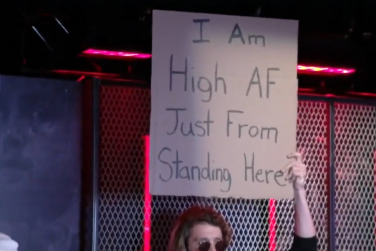 PHOTO Woman Holding Sign That Says I Am High AF Just From Standing Here