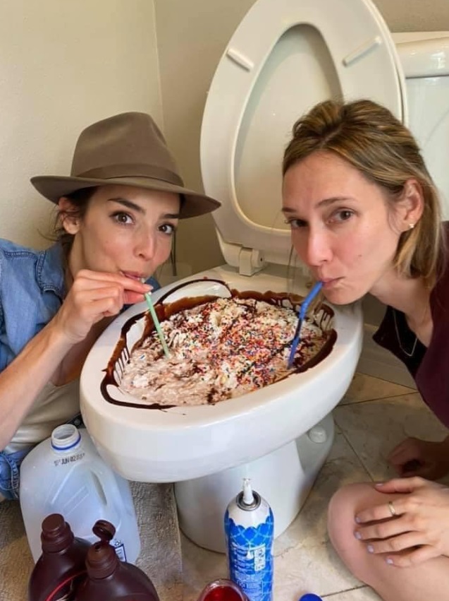 PHOTO Two Chicks Drinking Ice Cream With Chocolate Syrup Out Of Toilet With Straws