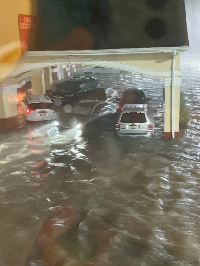 PHOTO Parking Lot In Laplace Louisiana Flooded Cars Damaged By Water Up To The Roofs