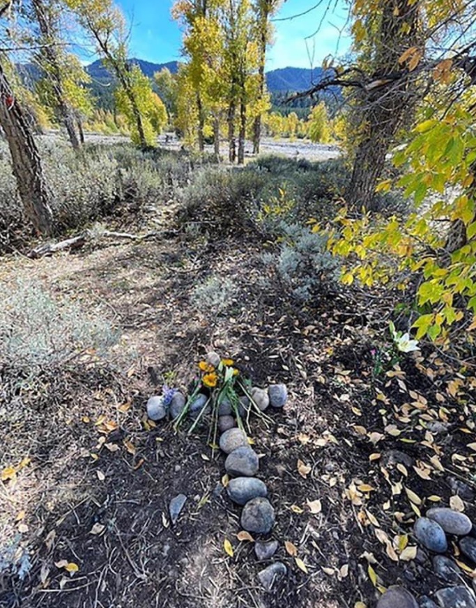 PHOTO Gabby Petito's Stepfather Lays Stone Cross And Flowers At Exact Spot Remains Were Found In Bridger-Teton National Forest