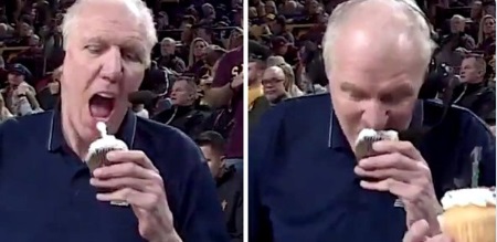 Bill Walton Biting Into A Cupcake With A Candle On It Still Shot