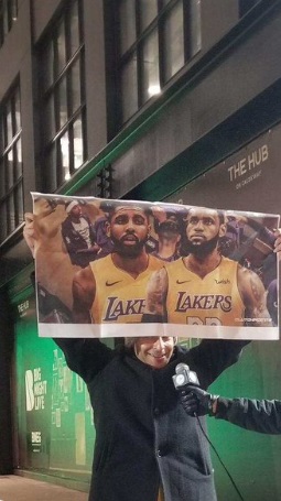 PHOTO Lakers Fan Holding Poster Of Kyrie Irving Lebron James In Lakers Jerseys