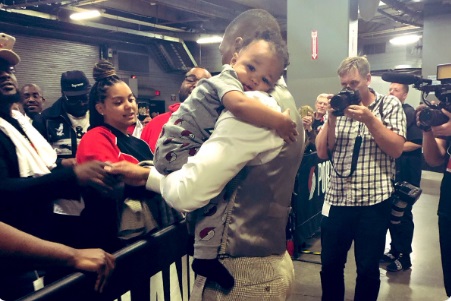 PHOTO Damian Lillard Casually Holding His Baby Son While High Fiving Fans On His Way Out The Back Door Of The Arena