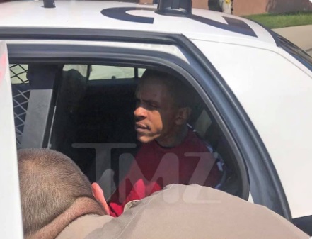 PHOTO Eric Holder In LA Sheriff Car After Arrest