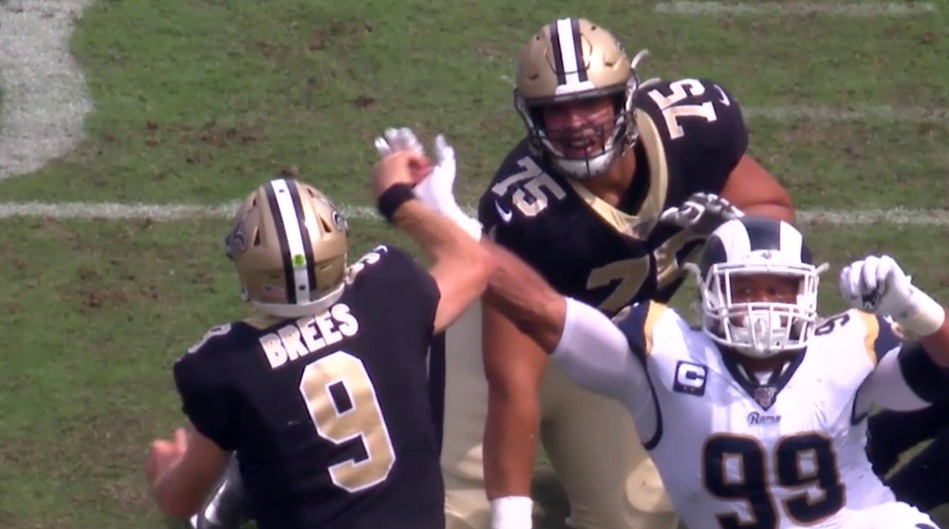 Close Up Photo Of Aaron Donald's Hand Jamming Drew Brees' Thumb