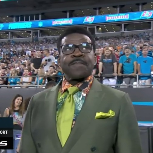 Close Up Photo Of Michael Irvin's Dark Green Grinch Suit And Bright Green Tie