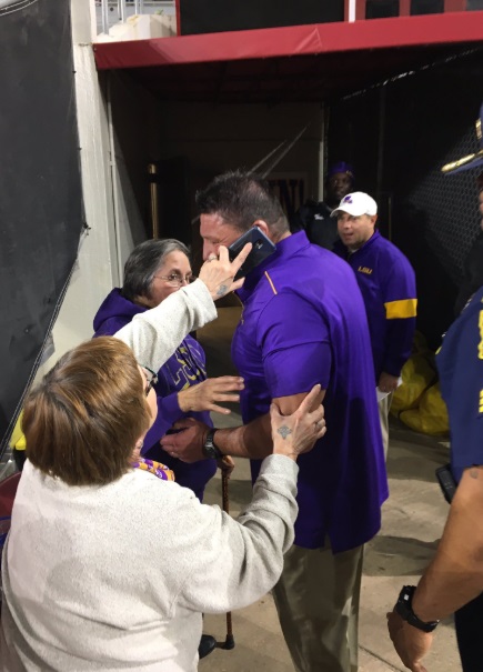 PHOTO Ed Orgeron Takes Phone Call On The Field