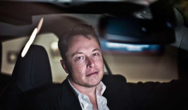 PHOTO Elon Musk With His Hand On Steering Wheel Driving Tesla Cybertruck