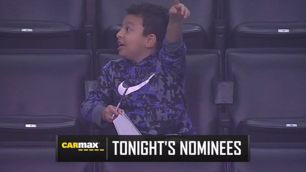 PHOTO Kid Doing His Homework At Clippers Game