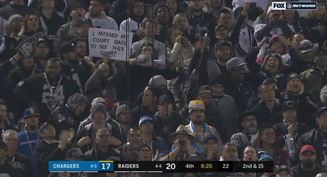 Photo Raiders Fan Holding Sign That Says I Missed My Court Date To See This Game