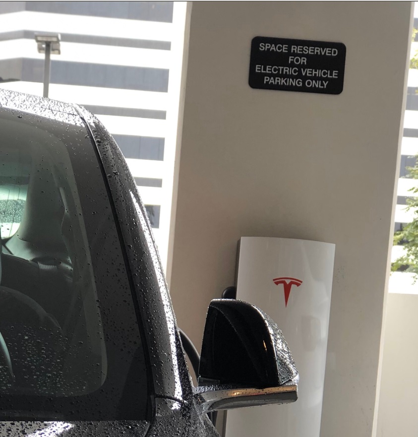 PHOTO Tesla Dealership Has Sign That Says Space Reserved For Electric Vehicle Parking Only