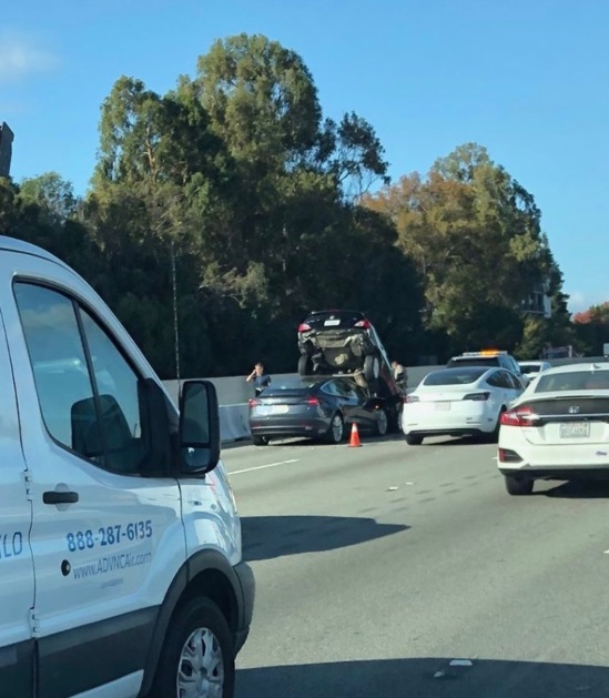 PHOTO Tesla Owner Managed To Drive Under Persons Car And have It Sit On Top Of Their Tesla