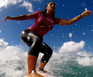 PHOTO Tulsi Gabbard Surfing On A Wave