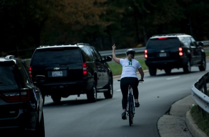 PHOTO Women On Bike Flips Off Donald Trump's Motorcade