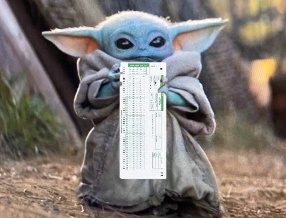 PHOTO Baby Yoda Holding A Scantron For Final Exams