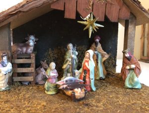 PHOTO Baby Yoda Laying In Manger In Nativity Scene