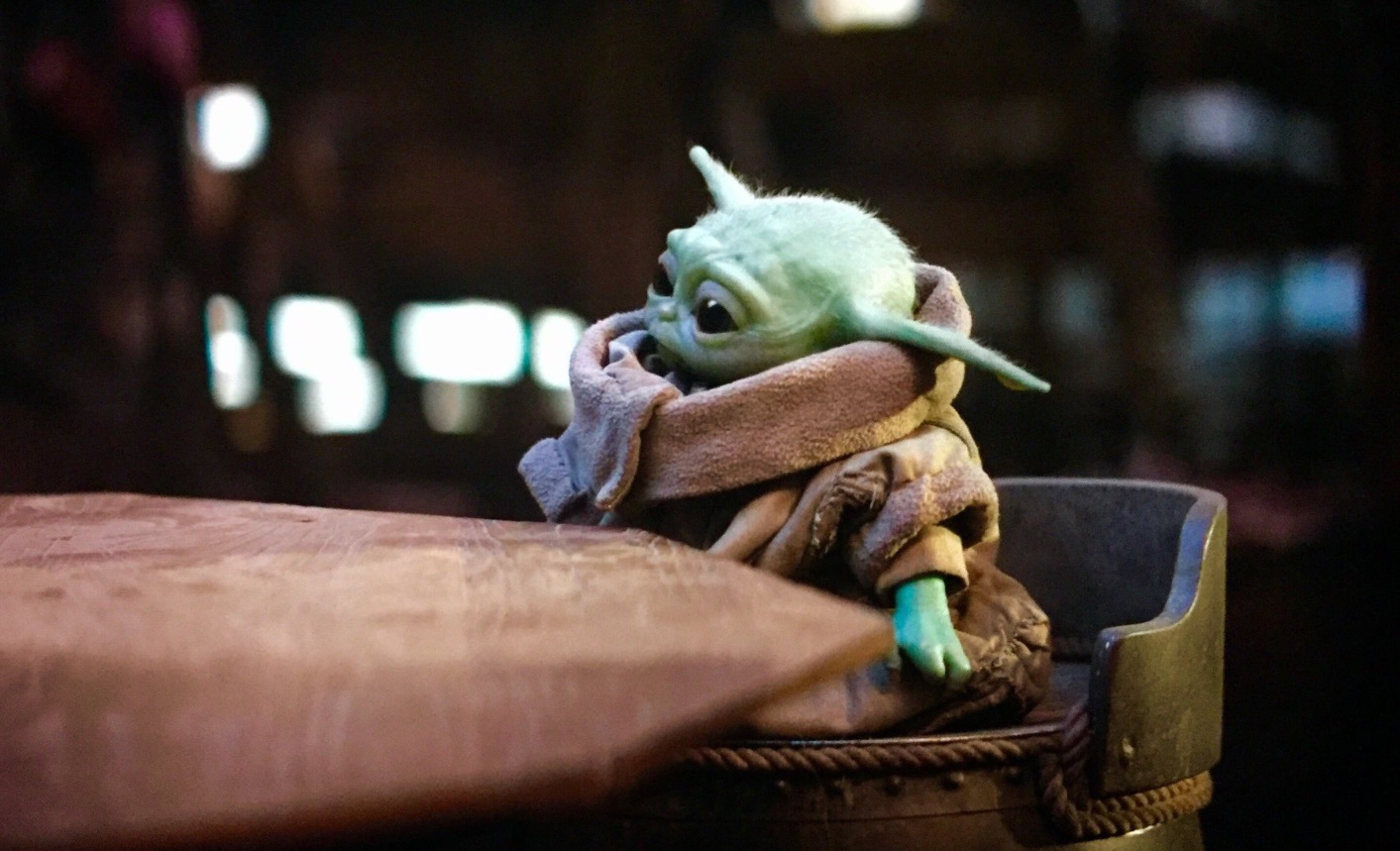 PHOTO Baby Yoda Sitting At Dinner Table Waiting For Food To Arrive