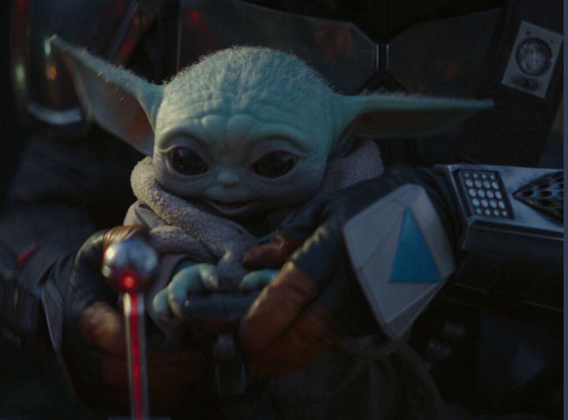 PHOTO Baby Yoda Smiling After Getting AUX Cord Back