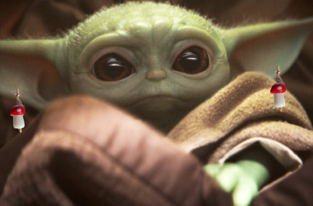 PHOTO Baby Yoda Wearing Mushroom Earrings