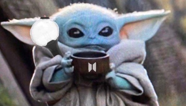 PHOTO Baby Yoda With A Plushie