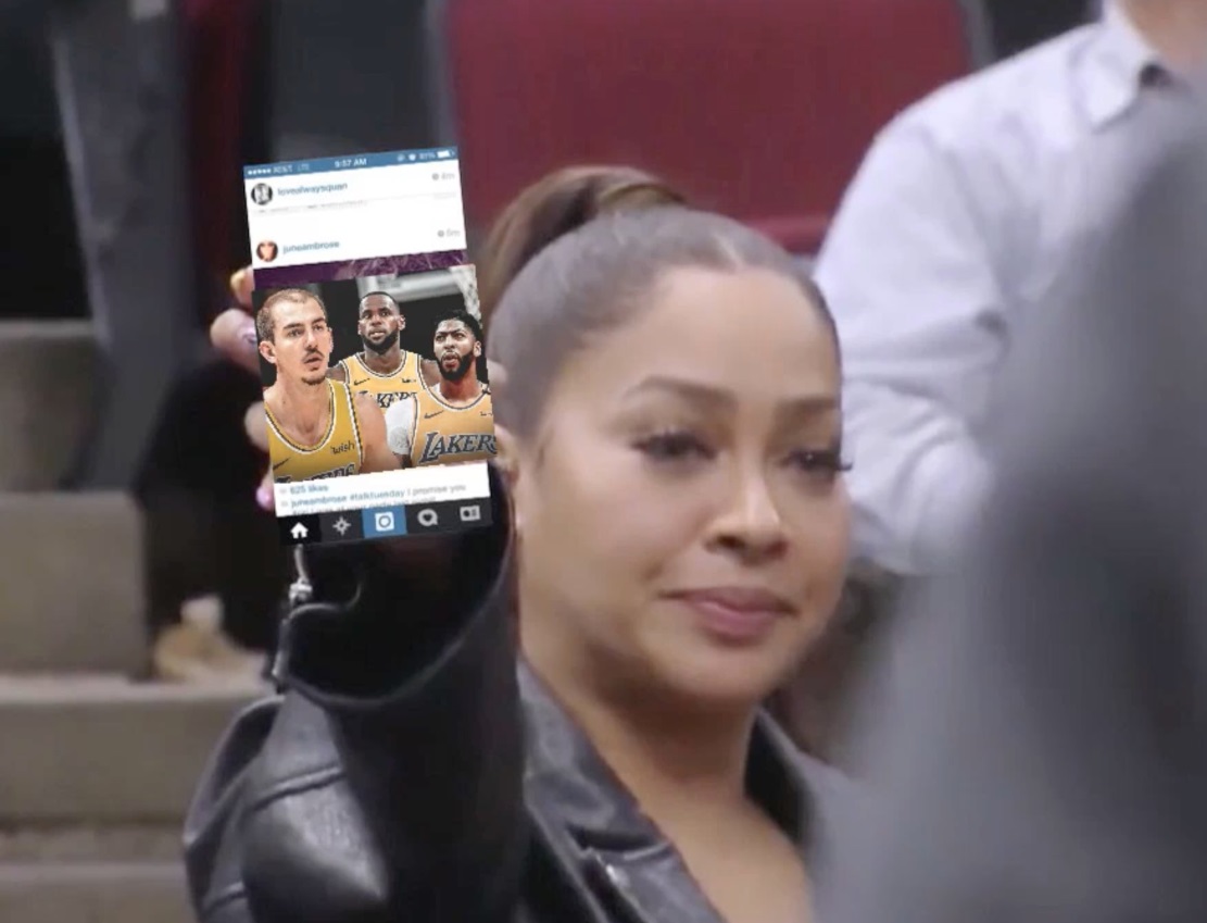 PHOTO Lady At Blazers Game Holds Up Her Phone For The TV Cameras To See That Lakers Big 3 Of Caruso Davis And Lebron Because She's Really A Lakers Fan