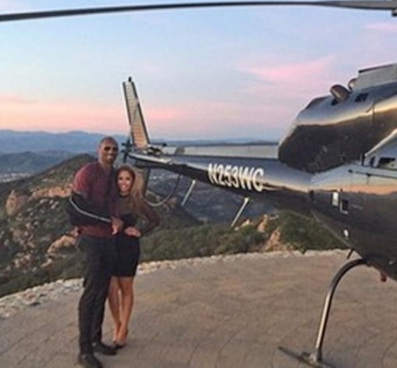 PHOTO Kobe Bryant Hugging His Wife While Taking A Picture Up On A Hill Next To His Helicopter