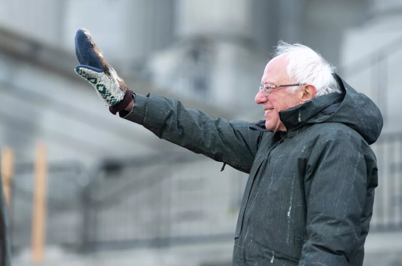 PHOTO Bernie Sanders Waving With A Giant Hand Muff On His Hand