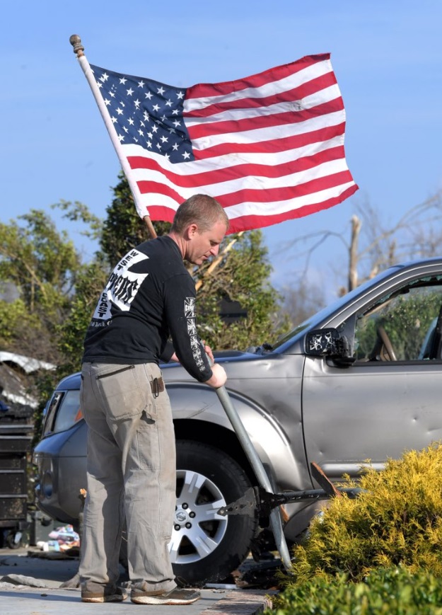 PHOTO Cookeville Man Plants Flag As Hope While Cleaning Up During Recovery