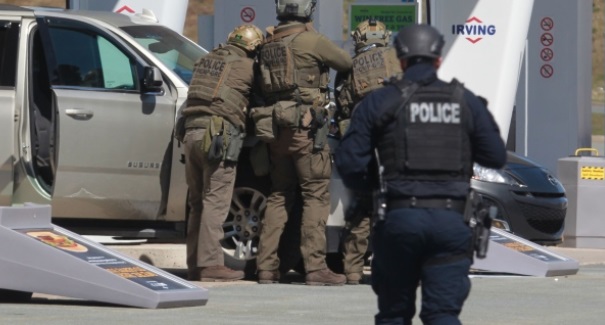 PHOTO Canadian Police Take Cover Behind Mini Van During Active Shooter Incident