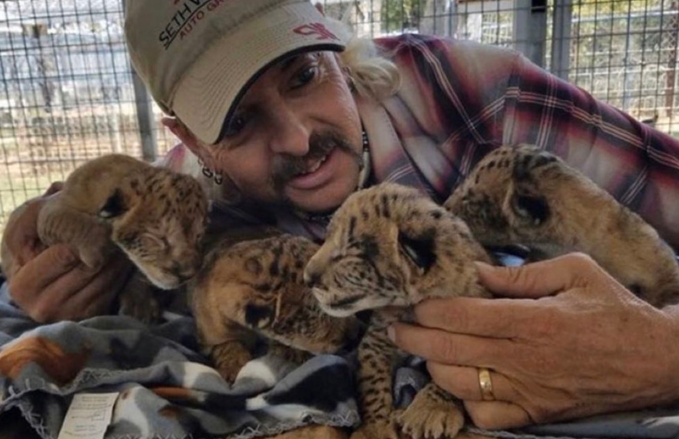 PHOTO Joe Exotic Hugging Baby Tiger Cats