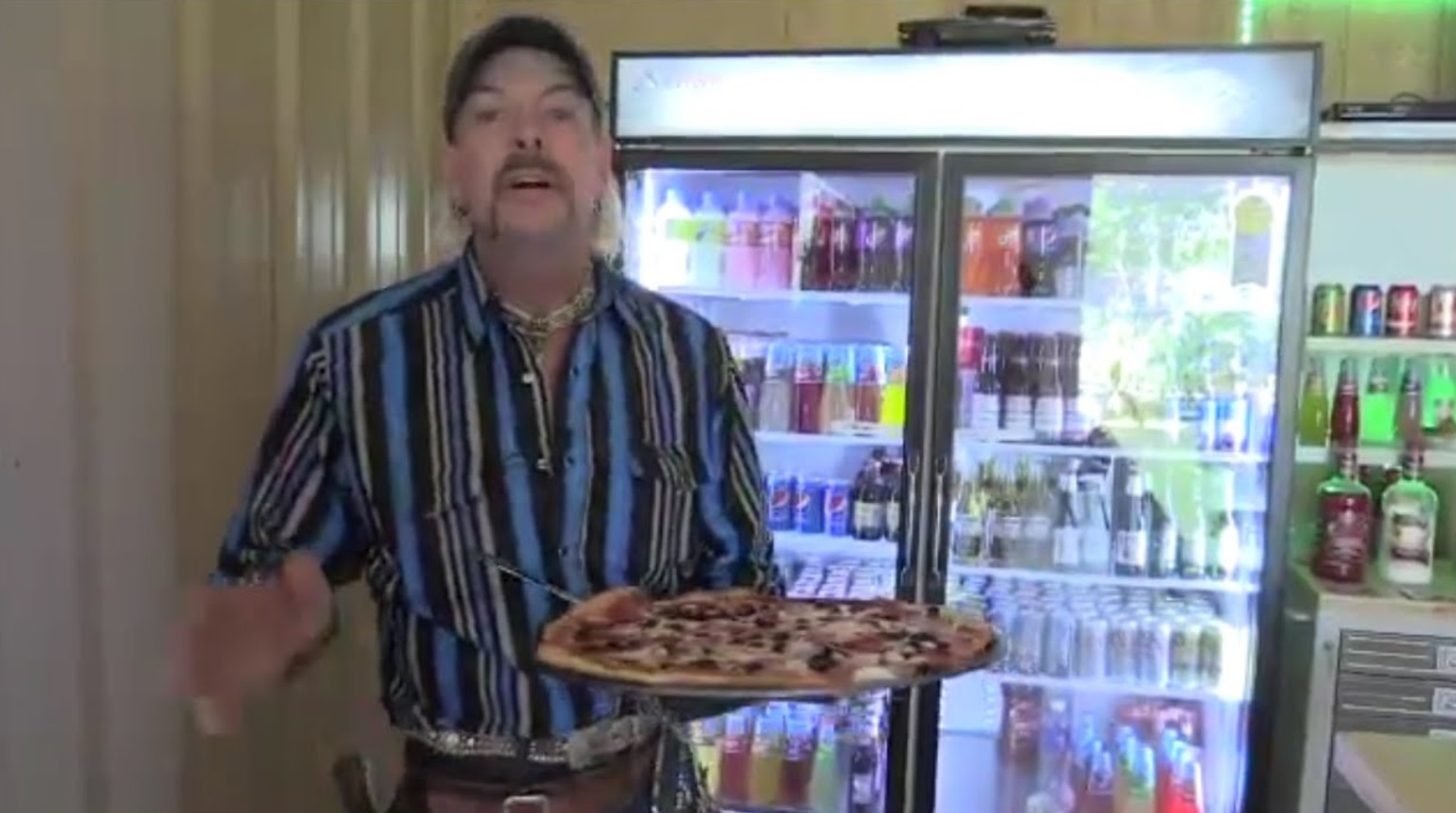 PHOTO Joe Exotic With A Large Pizza