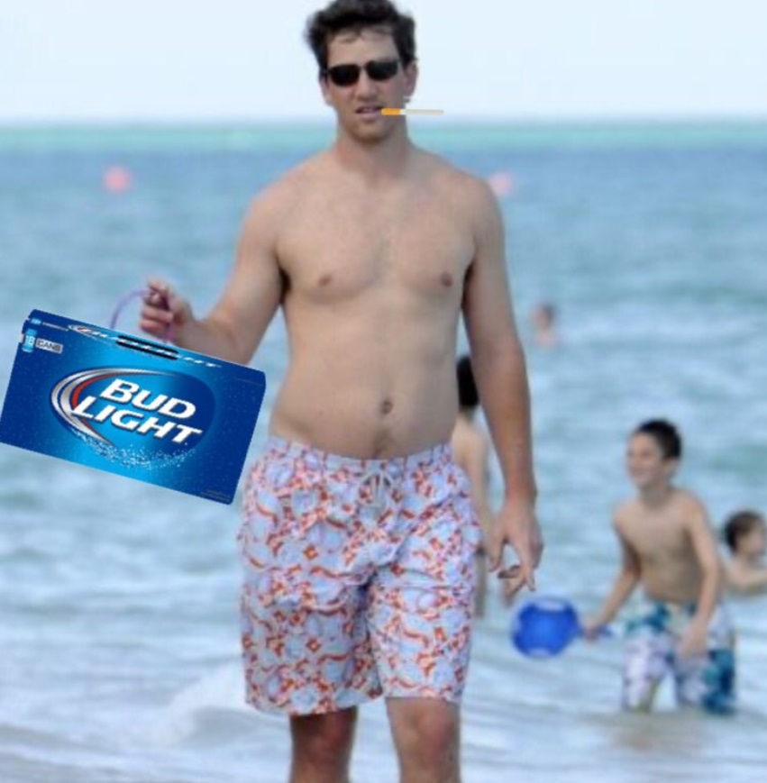 PHOTO Eli Manning Looking Fat Watching The Match From The Beach With Bud Light And A Cigarette