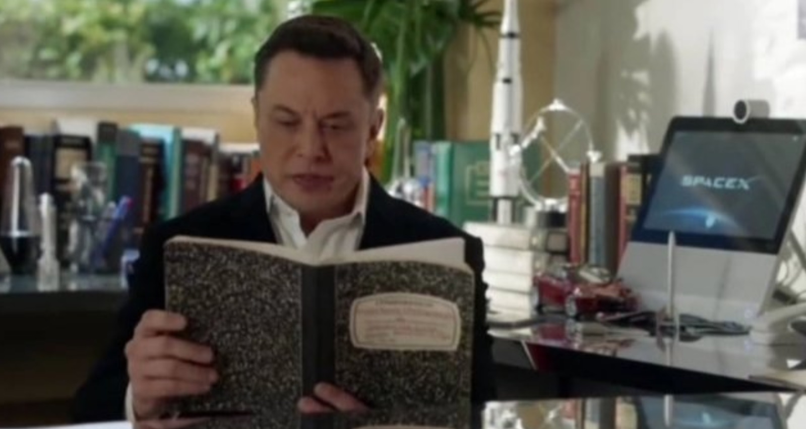 PHOTO Elon Musk Reading Notes In His Tesla Office