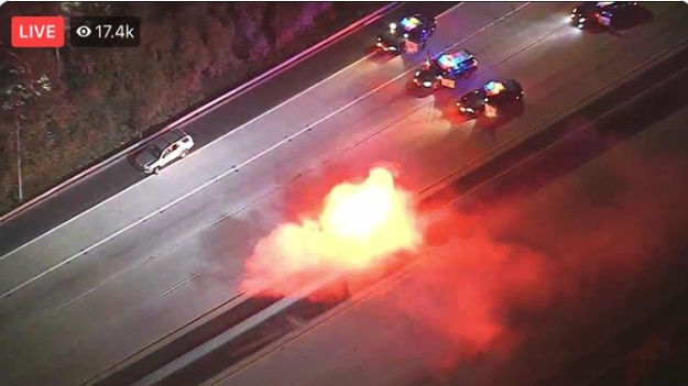 PHOTO Fire Starts On Freeway After LA Police Chase Suspect Throws Lit Flare Out Window