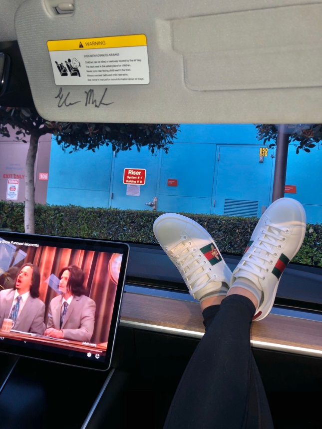 PHOTO Hot Chick Wearing Gucci Shoes While Watching Eric Andre On Tesla Dashboard Screen