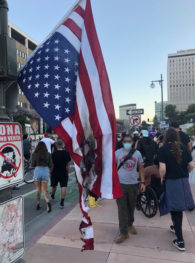 PHOTO Protesters In Downtown LA Burnt An American Flag