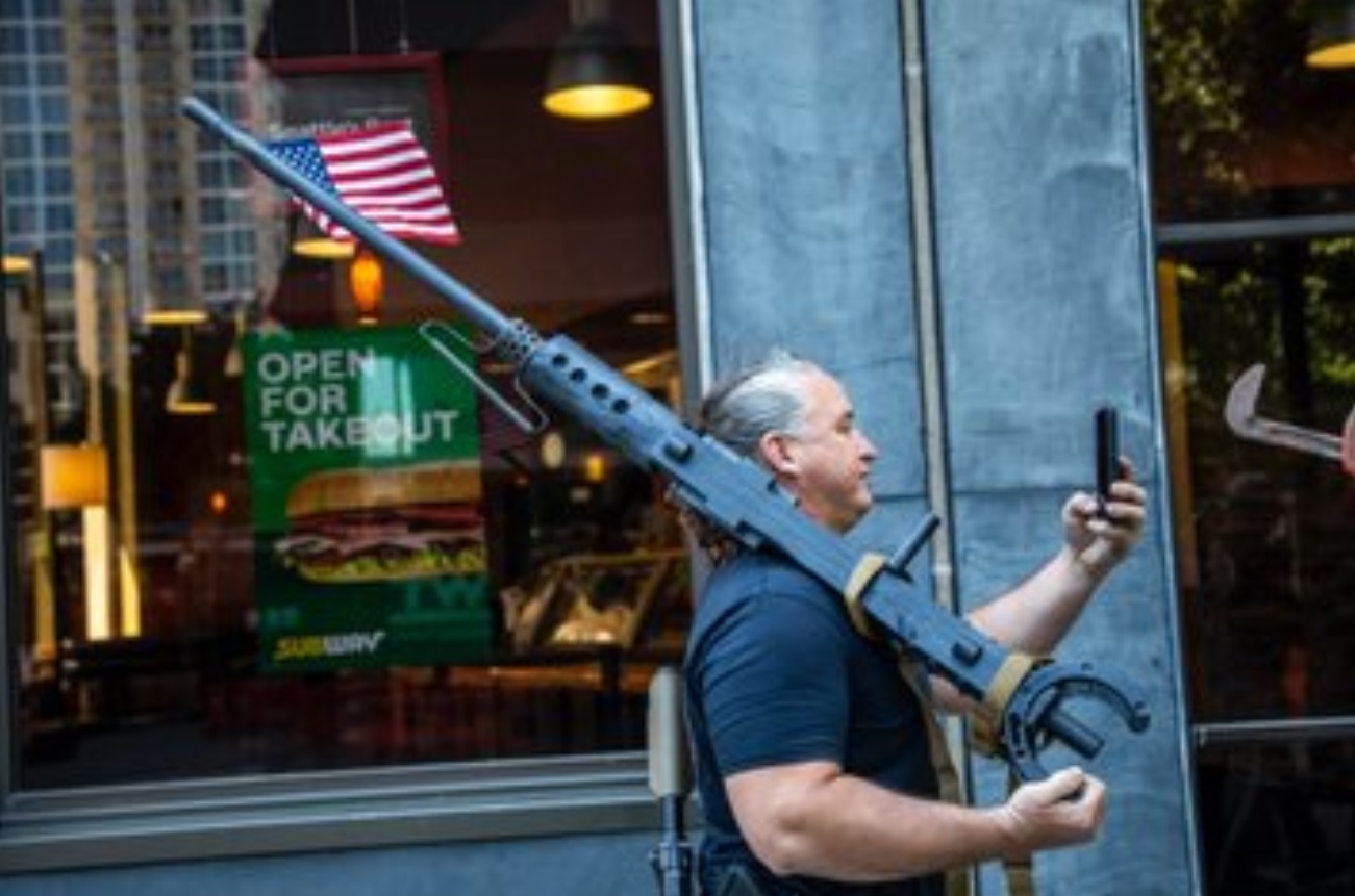 PHOTO Protester With 7 Foot Long Gun Filming Himself In Raleigh