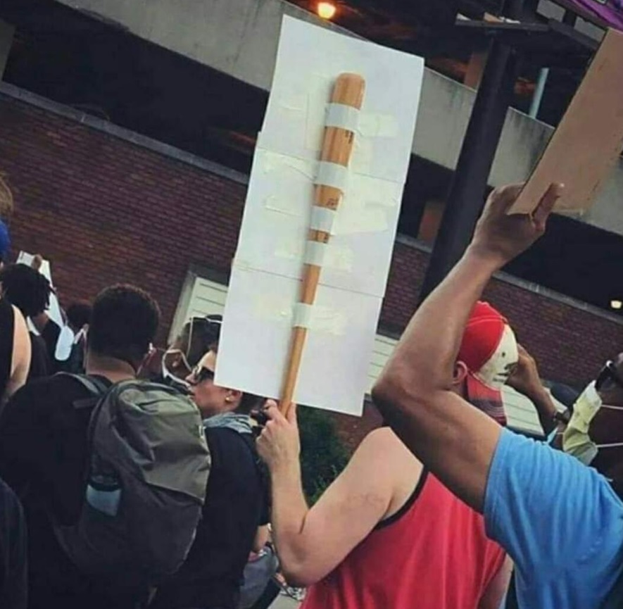 PHOTO BLM Protester Has Baseball Bat Tapped To His Sign