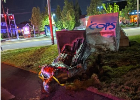 PHOTO Monument Grafittied With COPS In Blue Spray Paint