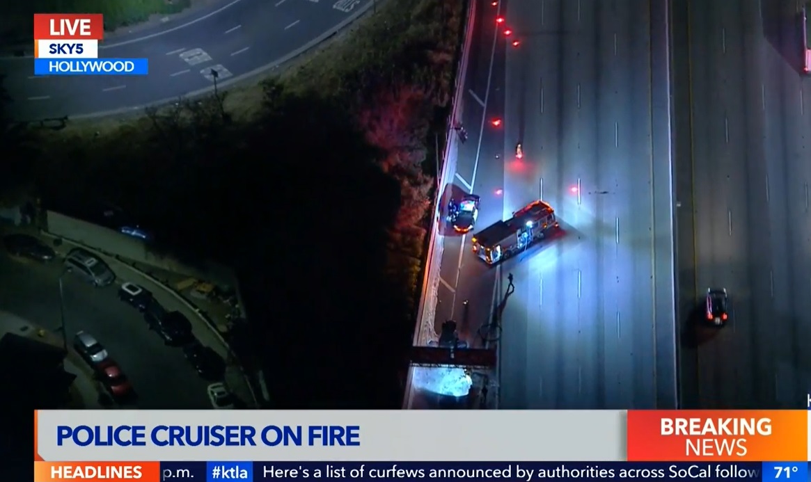 PHOTO Police Car Burning On 101 Freeway Near Sunset.Police Car Burning On 101 Freeway Near Sunset