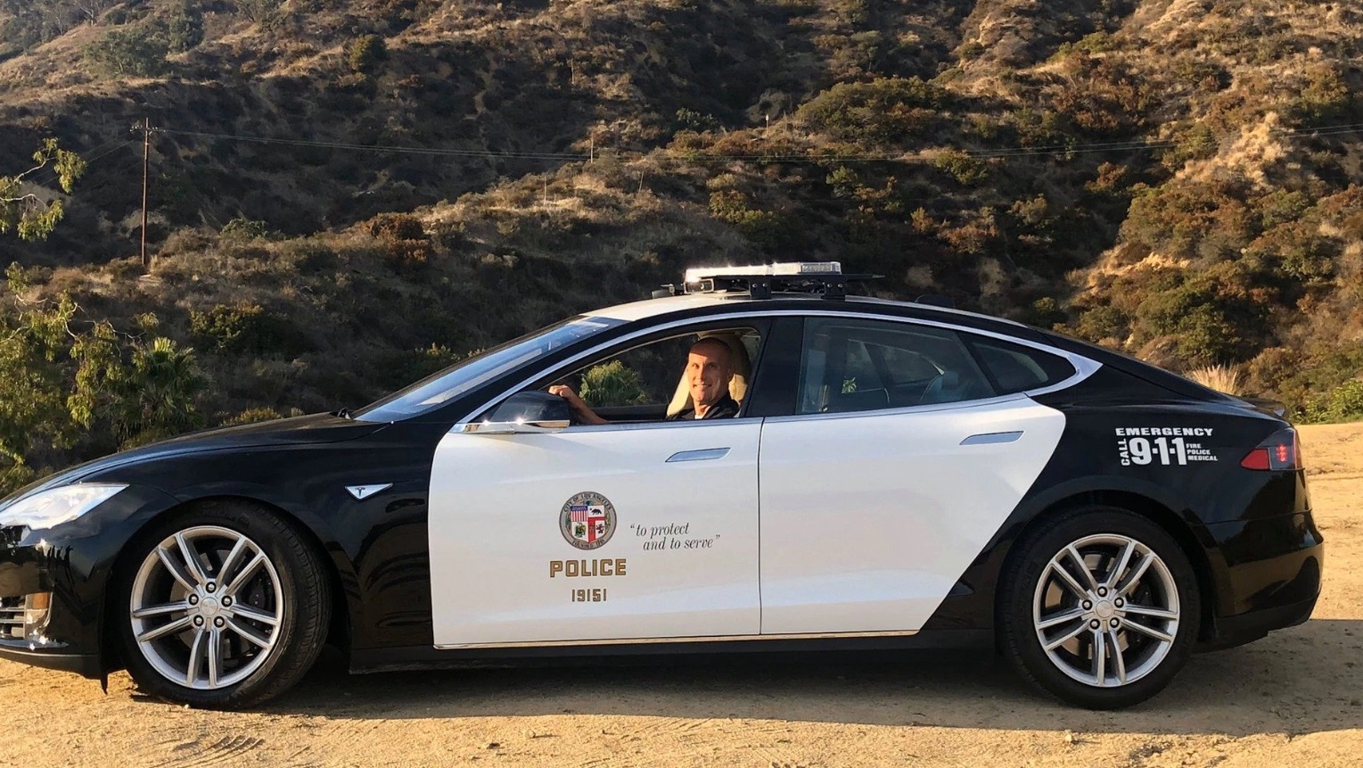 PHOTO Police Officer In Los Angeles Driving A Tesla Patrol Car