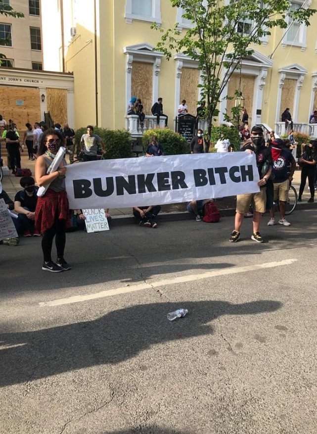 PHOTO Protesters Holding Bunker Bt*ch Sign