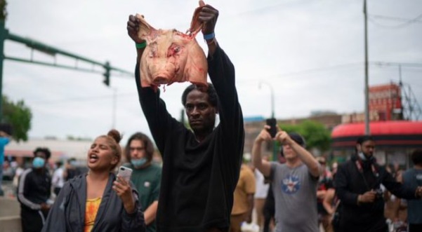 PHOTO Black Lives Matter Protesters Holding Up Severed Pigs Head