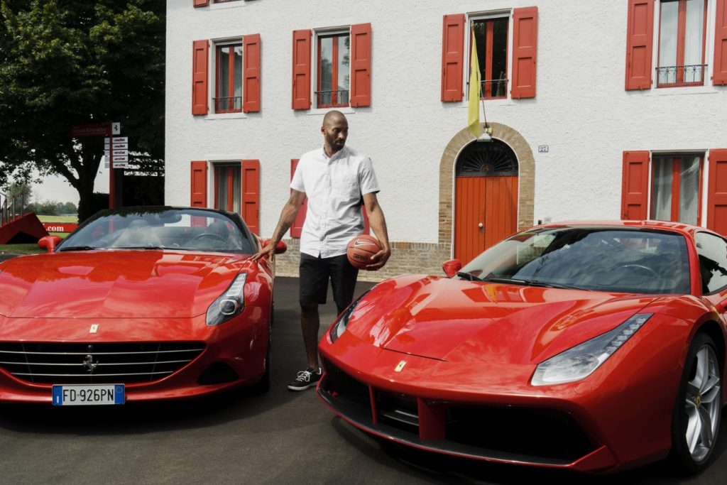 PHOTO Kobe Bryant Standing Between Two Ferrari's